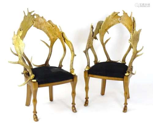 A pair of Anthony Redmile antler chairs, having tub style ba...