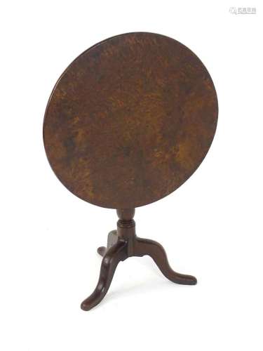 A George III tilt top table with a solid burr oak top above ...