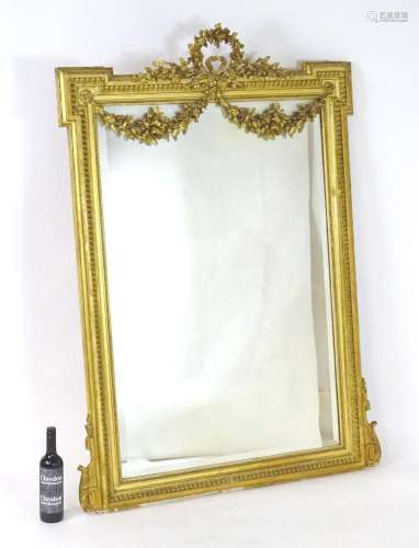 A 19thC Neo-classical style mirror of giltwood and gesso con...