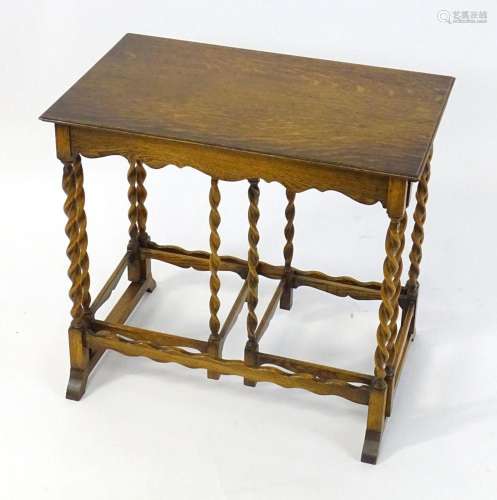 A mid 20thC nest of three tables of oak construction. This u...
