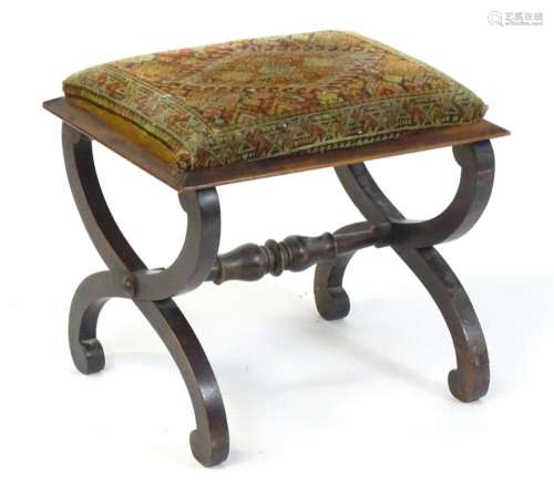 A 19thC X- frame stool with an upholstered top and moulded r...