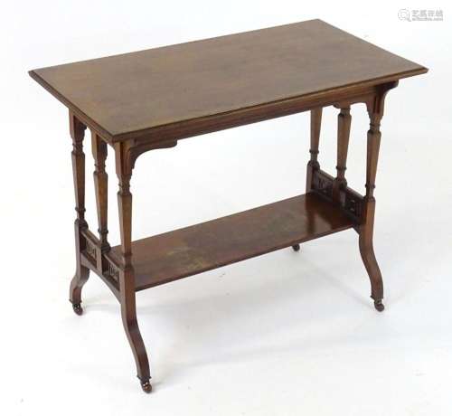 A late 19thC / early 20thC walnut occasional table with a re...