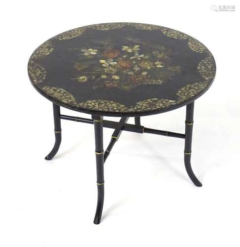 A late 19thC occasional table with a circular painted top an...