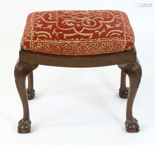 An early 20thC mahogany stool, having a drop in seat above b...