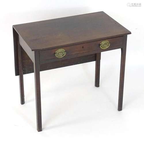 A Georgian mahogany drop flap table, having a single long dr...