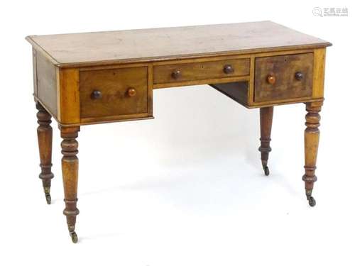 A 19thC mahogany desk, having a moulded top above three shor...