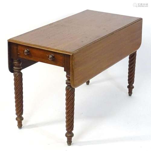 A late 19thC mahogany Pembroke table with drop flaps to eith...