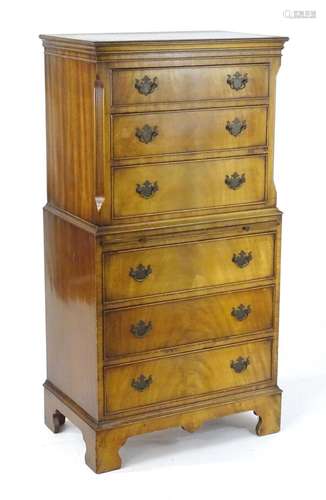 A mid / late 20thC chest of drawers / chest on chest, having...