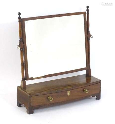 An early 19thC mahogany toilet / dressing mirror, having tur...