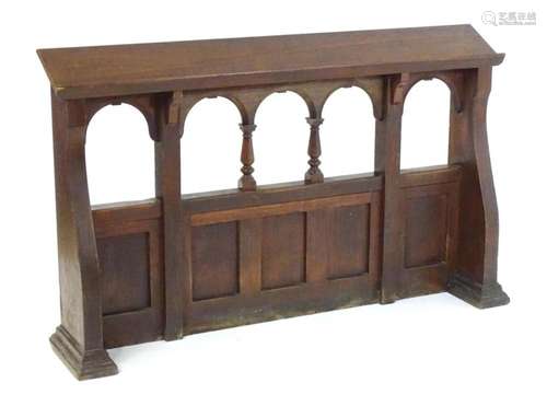 A 20thC oak church railing / ecclesiastical pew back with Pu...