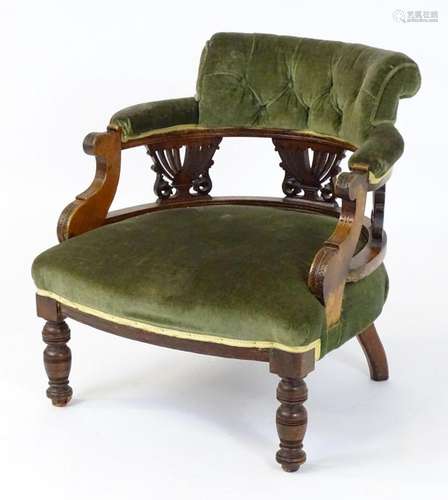 A late 19thC / early 20thC tub chair, the chair having an up...