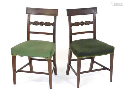 A pair of Regency mahogany side chairs with a bowed top rail...