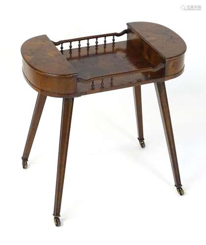 A 19thC oyster veneered yew wood work table with two lifting...