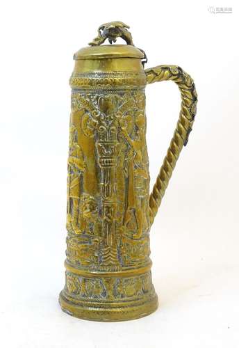 A late 19 / early 20thC large German brass stein with emboss...