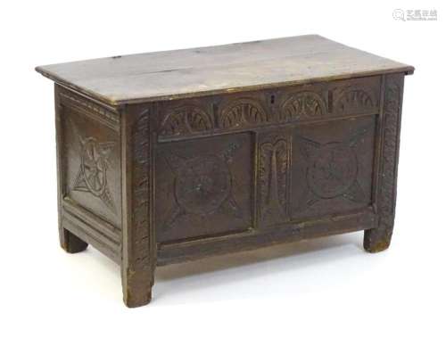 A late 17thC coffer of small proportions, having a nulled fr...