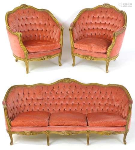 A mid 20thC salon suite comprising two armchairs and a sette...