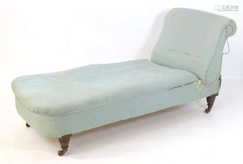 A Victorian chaise longue with a scrolled drop end above tur...