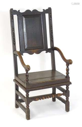 A 17thC oak open armchair with a peg jointed open armchair /...