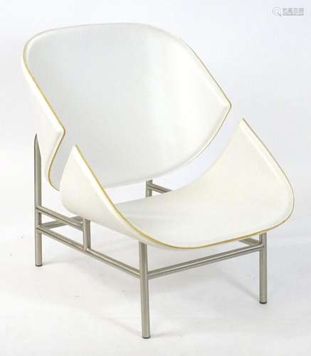 A Modernist style Scandinavian designed lounge chair with a ...