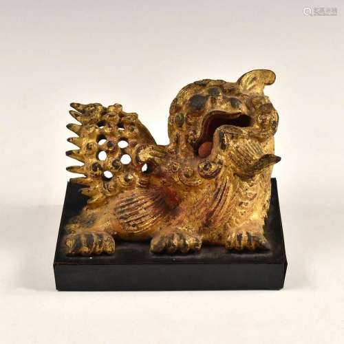 A CHINESE BRONZE FOO LION ON STAND