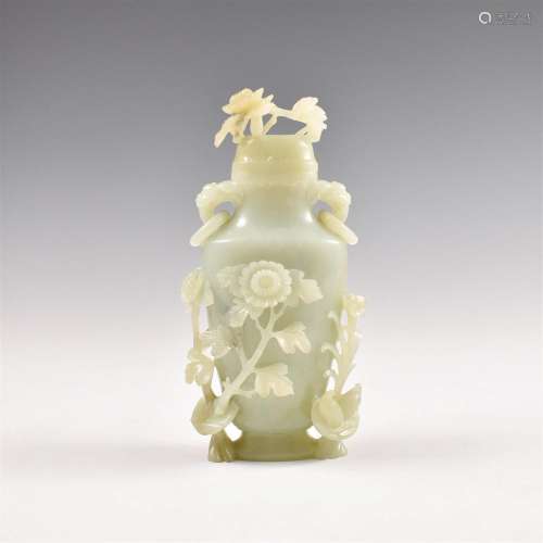 A CHINESE AN OPEN WORK CARVED JADE LIDDED VASE