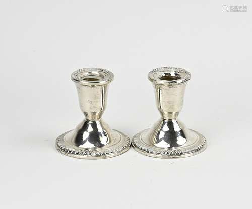 2 silver candlesticks