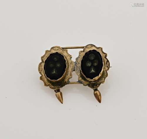 Gold brooch with onyx