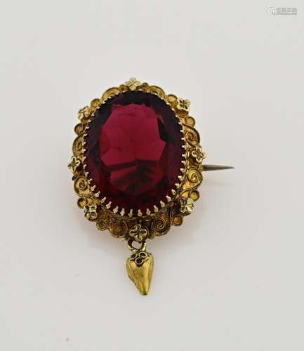 Gold regional brooch with red stone