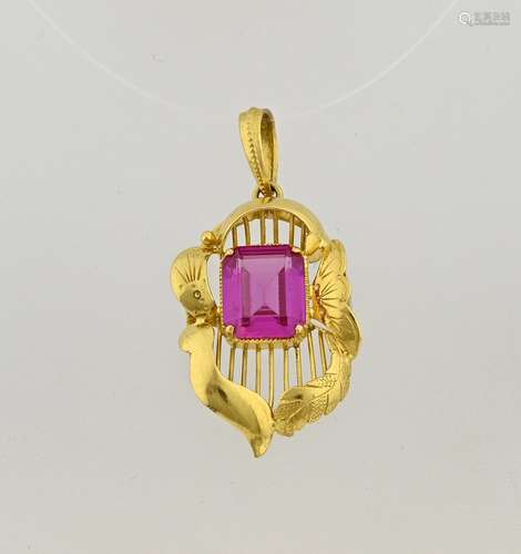 Gold pendant with red stone