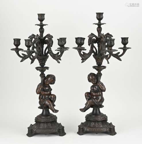 Two putti candlesticks, H 54 cm.