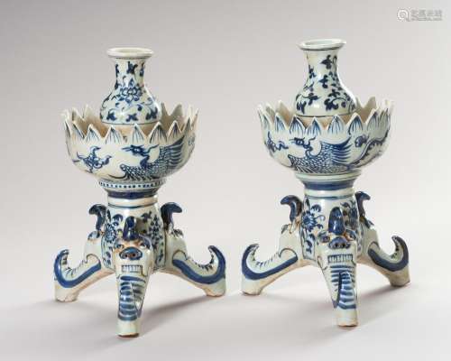 A PAIR OF MING STYLE BLUE AND WHITE CANDLE HOLDERS