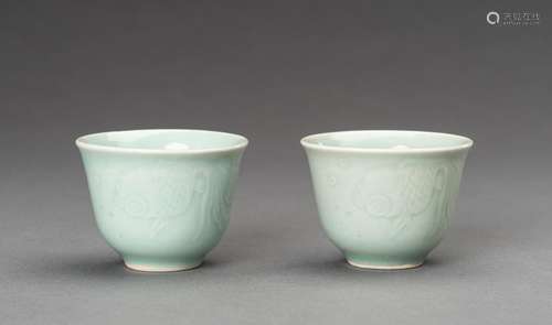 A PAIR OF CELADON PORCELAIN CUPS WITH CELESTIAL EYES FISH, c...