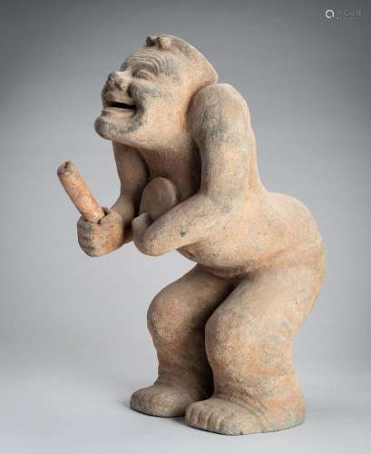 A HAN-STYLE TERRACOTTA FIGURE OF A SQUATTING DRUMMER