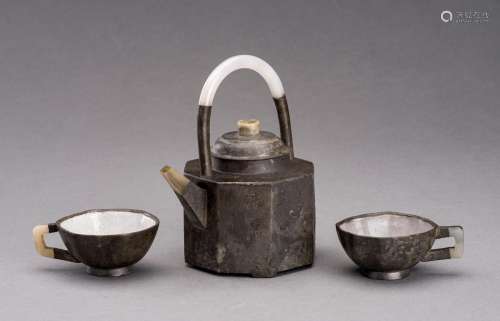 A YIXING PEWTER-ENCASED AND JADE-INSET TEAPOT AND TWO CUPS, ...