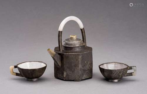 A YIXING PEWTER-ENCASED AND JADE-INSET TEAPOT AND TWO CUPS, ...