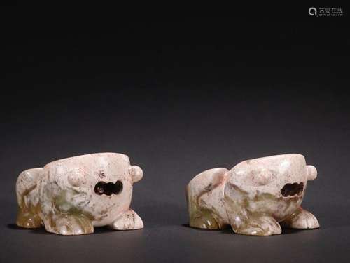 A pair of jade "frog" ornaments