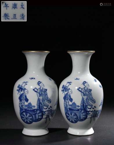 A pair of vases with blue and white painted bat characters