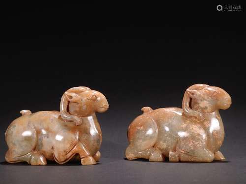 A pair of jade "sheep" ornaments