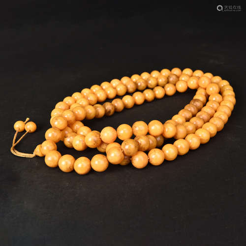 A STRING OF AMBER BEADS