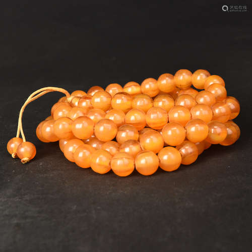 A STRING OF AMBER BEADS