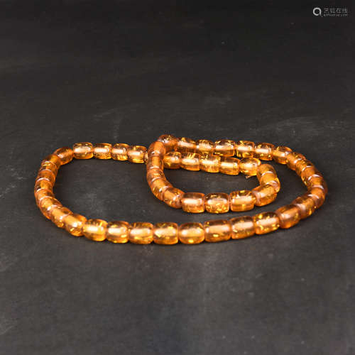 A STRING OF AMBER BEADS