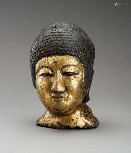 A GILT BRONZE HEAD OF BUDDHA