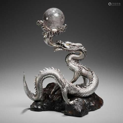 † SANMI: A MASTERFUL SILVER OKIMONO OF A DRAGON WITH ROCK CR...