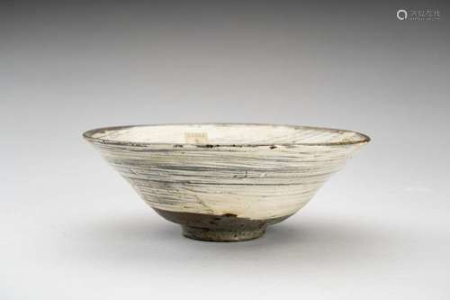 AN INCISED CERAMIC BOWL