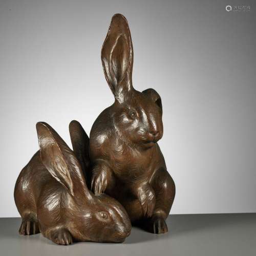 † HIROYUKI: A FINE BOXWOOD OKIMONO OF LONG-EARED HARES