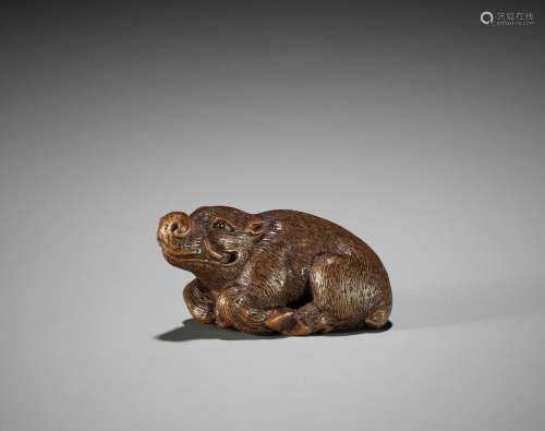 KOKEI: A FINE WOOD NETSUKE OF A RECUMBENT BOAR