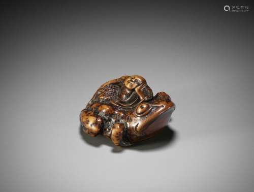 SHUYA: A WOOD NETSUKE OF GAMA SENNIN ON A TOAD