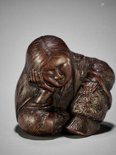 TADATOSHI: A SUPERB NAGOYA SCHOOL WOOD NETSUKE OF A SEATED S...