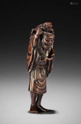 TADATOSHI: A LARGE WOOD NETSUKE OF GAMA SENNIN