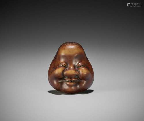 GYOKKO: A WOOD MASK NETSUKE OF OKAME